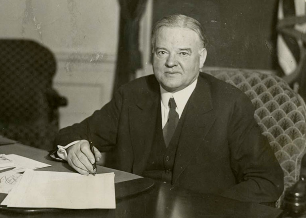 1930: Herbert Hoover signing unemployment relief bill